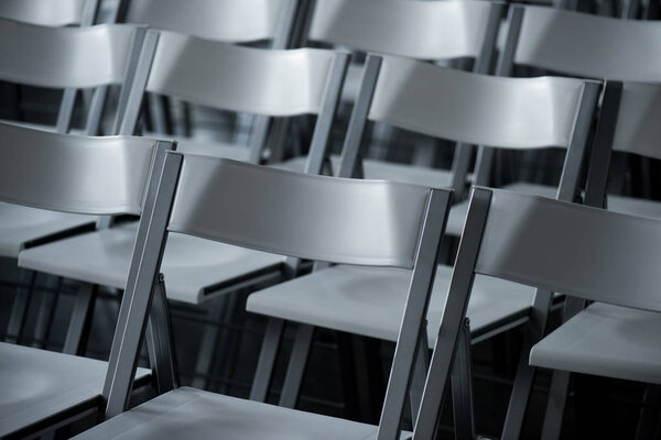 close up view of arranged empty modern chairs