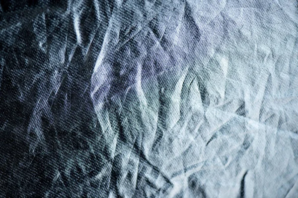 full frame of blue crumpled fabric background