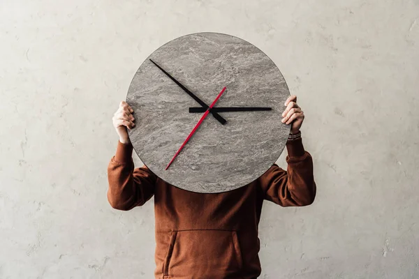 Person holding clock — Stock Photo