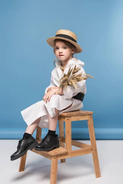 Little girl with wheat ears — Stock Photo