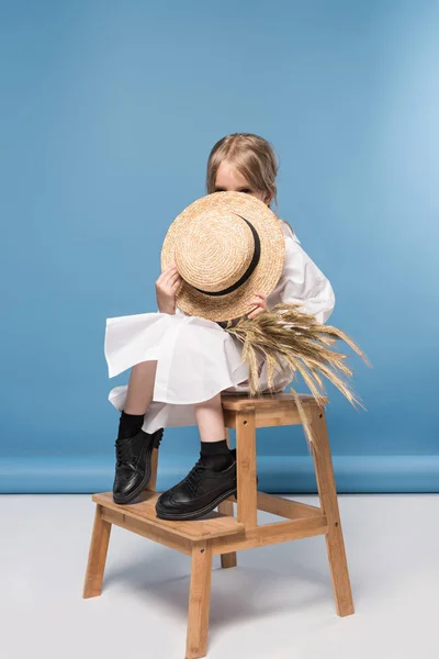 Little girl with wheat ears — Stock Photo