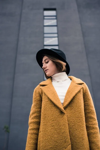 Beautiful woman in black hat — Stock Photo