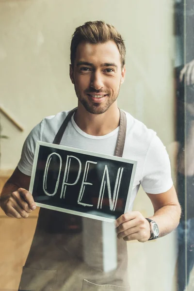 Waiter holding chalkboard with open word — Stock Photo