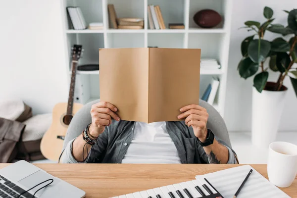 Musician reading magazine — Stock Photo