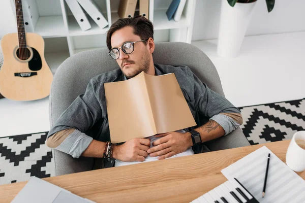 Exhausted musician sleeping — Stock Photo