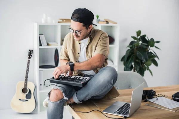 Modern dj working with MPC pad — Stock Photo