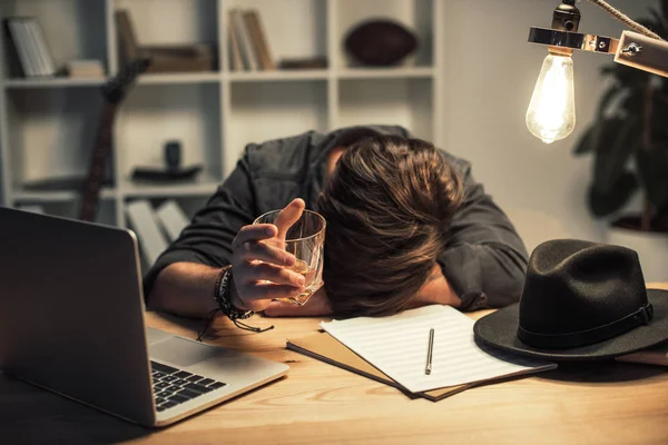 Unsuccessful musician drinking alone — Stock Photo