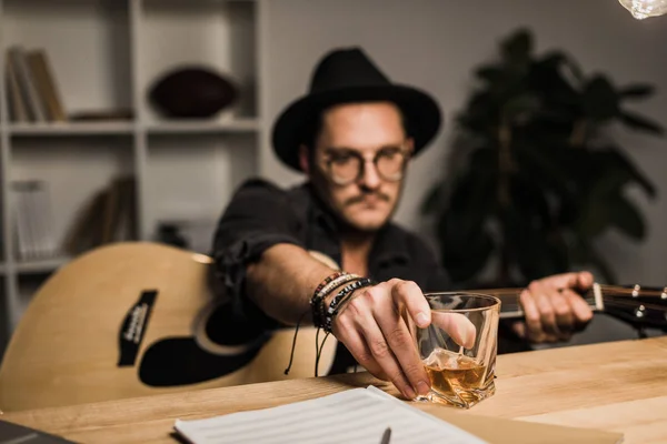 Unsuccessful musician drinking alone — Stock Photo