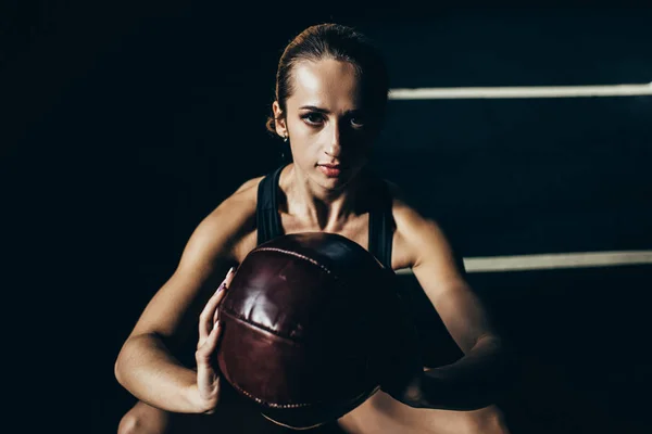 Sportswoman with weighted ball — Stock Photo