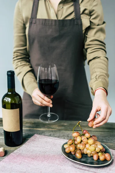 Sommelier holding glass of wine — Stock Photo