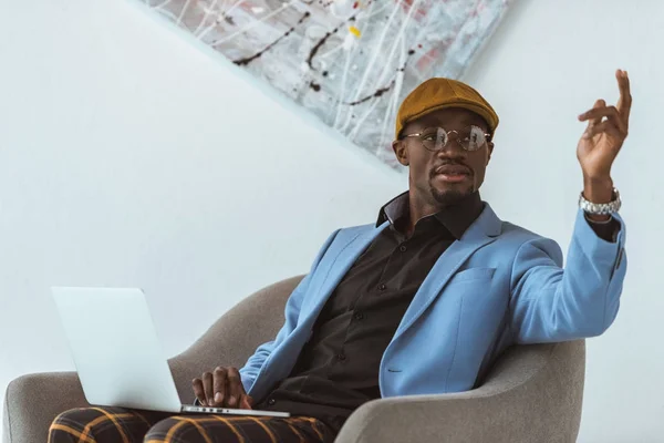 African american man with laptop — Stock Photo