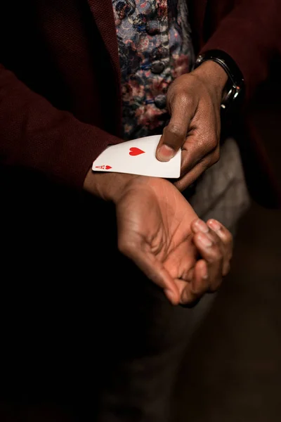 Man with ace in sleeve — Stock Photo