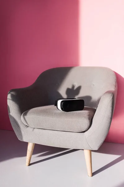 Virtual reality headset on armchair — Stock Photo