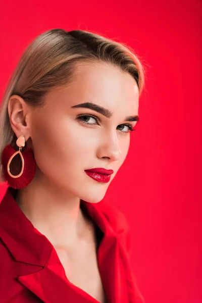Stylish girl posing in earrings — Stock Photo
