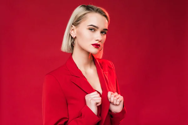 Elegant girl posing in red jacket — Stock Photo