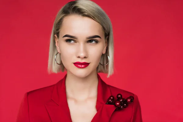 Girl in red suit with boutonniere — Stock Photo