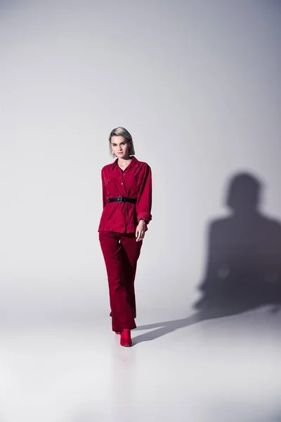 Elegant girl in red trendy clothes — Stock Photo