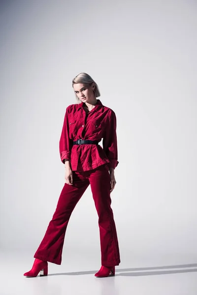 Elegant girl in red clothes — Stock Photo