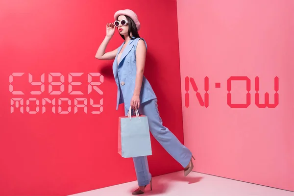 Stylish girl with shopping bags — Stock Photo