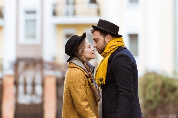 Young attractive couple standing close to each other — Stock Photo