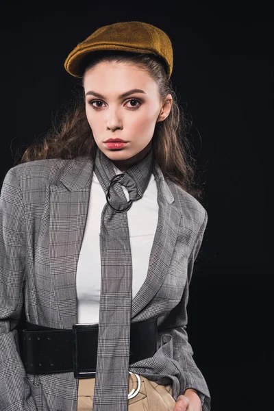 Portrait of elegant fashionable young woman looking at camera isolated on black — Stock Photo