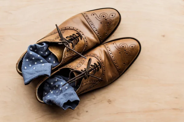 Top view of brown male shoes with socks inside — Stock Photo