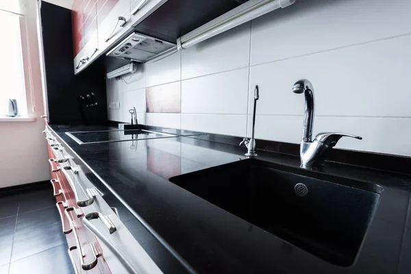 Close up view of sink and faucets in kitchen — Stock Photo