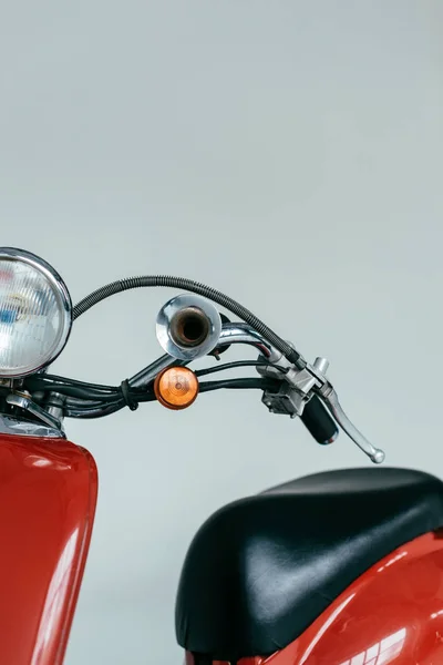 Red retro scooter bike isolated on grey — Stock Photo