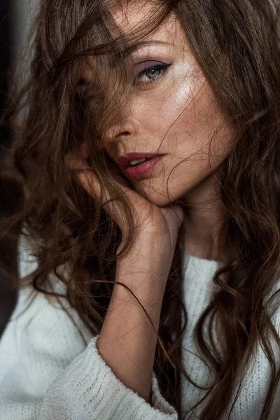 Close-up portrait of beautiful seductive brunette woman looking at camera — Stock Photo