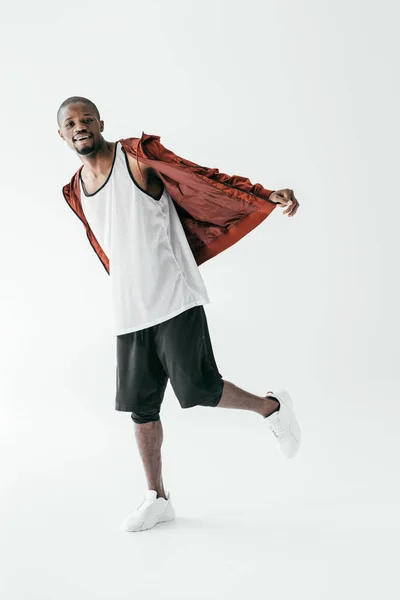 Happy african american man in sportswear, isolated on white — Stock Photo