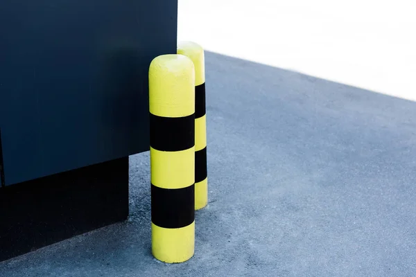 Restrictive fence poles on the corner of building — Stock Photo