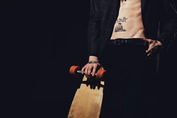 Cropped view of shirtless man with longboard, isolated on black — Stock Photo