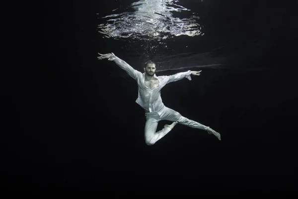 A young male ballet dancer posing underwater — Stock Photo, Image