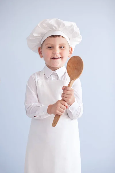 Child cook with a spoon — Stock Photo, Image