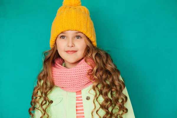 Cute little lady wearing yellow woolen cap and warm scarf — Stock Photo, Image