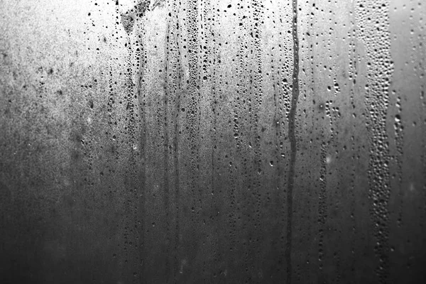 Flowing down water drops on window glass — Stock Photo, Image