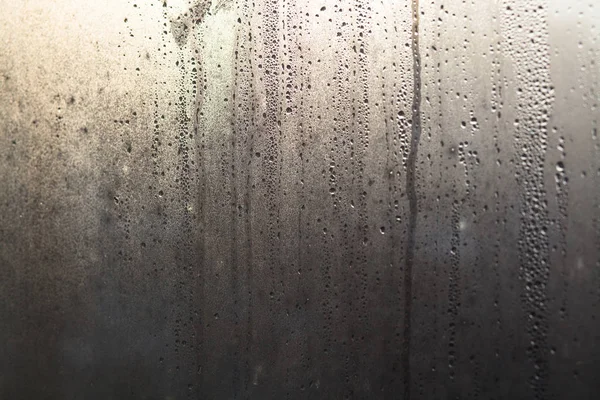 Flujo de gotas de agua en el vidrio de la ventana —  Fotos de Stock