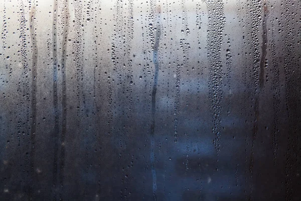 Flujo de gotas de agua en el vidrio de la ventana —  Fotos de Stock