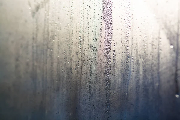 Flowing down water drops on window glass — Stock Photo, Image