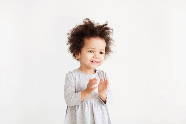 Cute funny little girl is clapping — Stock Photo, Image