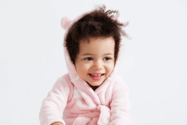 Cute little girl in soft pink bathrobe with hood — Stock Photo, Image