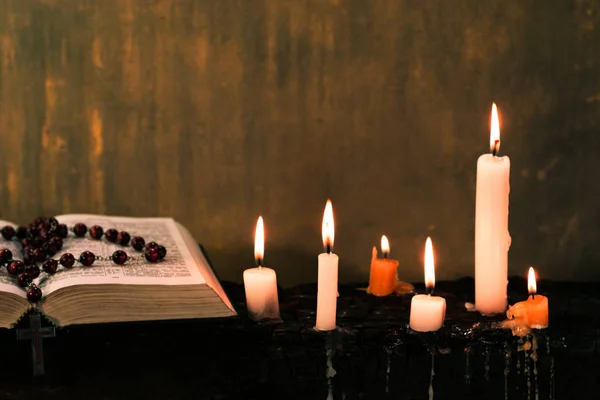 Bible Crucifix Beads Candle Old Wooden Burnt Table Beautiful Background — Stock Photo, Image