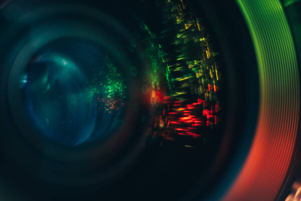 Beautiful abstract camera lens background multi colored glass reflection. Macro photography view.