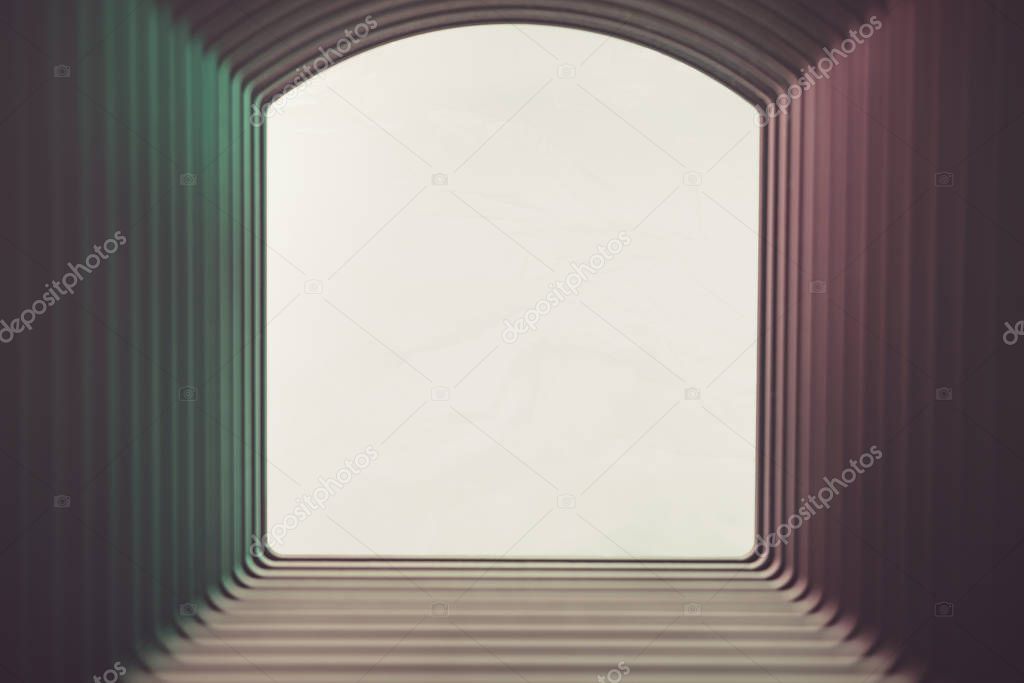 Beautiful abstract gray tunnel with color light on a white shine in the end background.