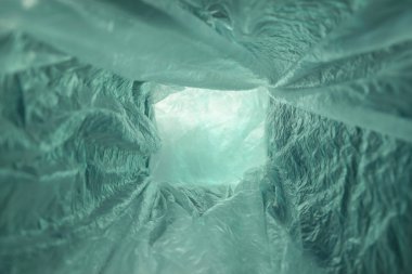 Beautiful abstract Aqua Menthe Tunnel background of plastic cellophane bag. No plastic bag concept saves the world, protects the earth. clipart