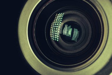 Beautiful camera lens with light reflection. Background pattern for design. Macro photography view.	