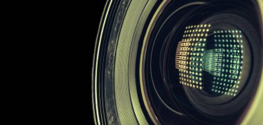 Beautiful camera lens with light reflection. Background pattern for design. Macro photography view.	