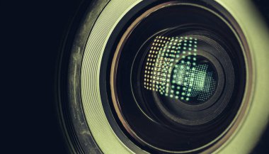 CLOSE UP Beautiful camera lens with light reflection on a black Background pattern for design.	