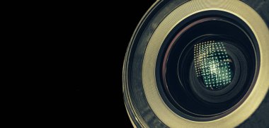 Beautiful camera lens with light reflection. Background pattern for design. Macro photography view.	