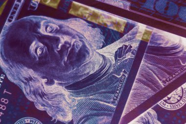 Close up Franklin's face on a one hundred dollar. American, US Dollars Cash Money in neon light.Minimalism retro style concept. 80s. Background pattern for design.	